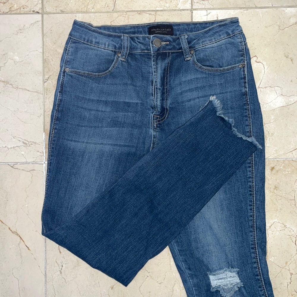 Distressed denim slim fit jeans